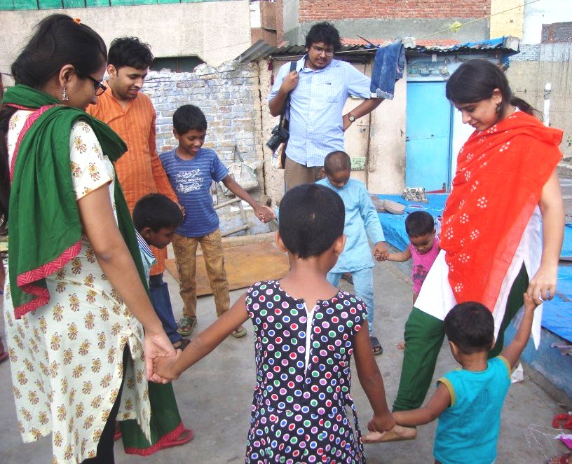 Gitanjali (right) with children and volunteers